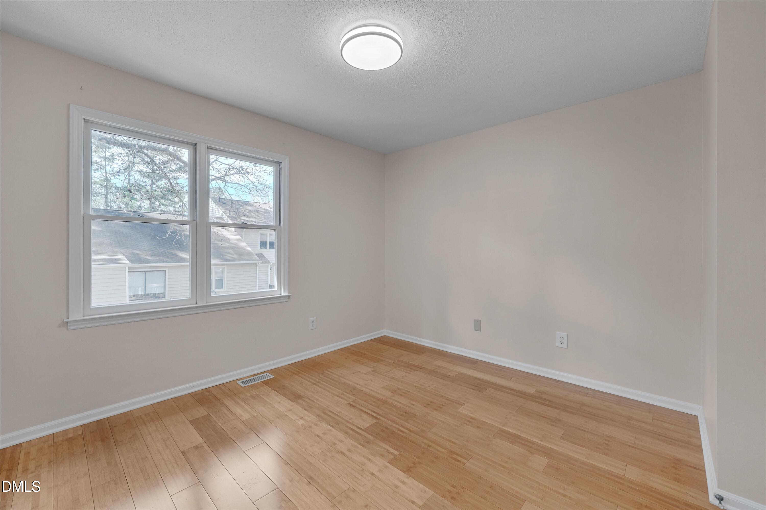 6528 Hearthstone Drive Raleigh, NC 27615 - Photo 20 of 32 an empty room with a window