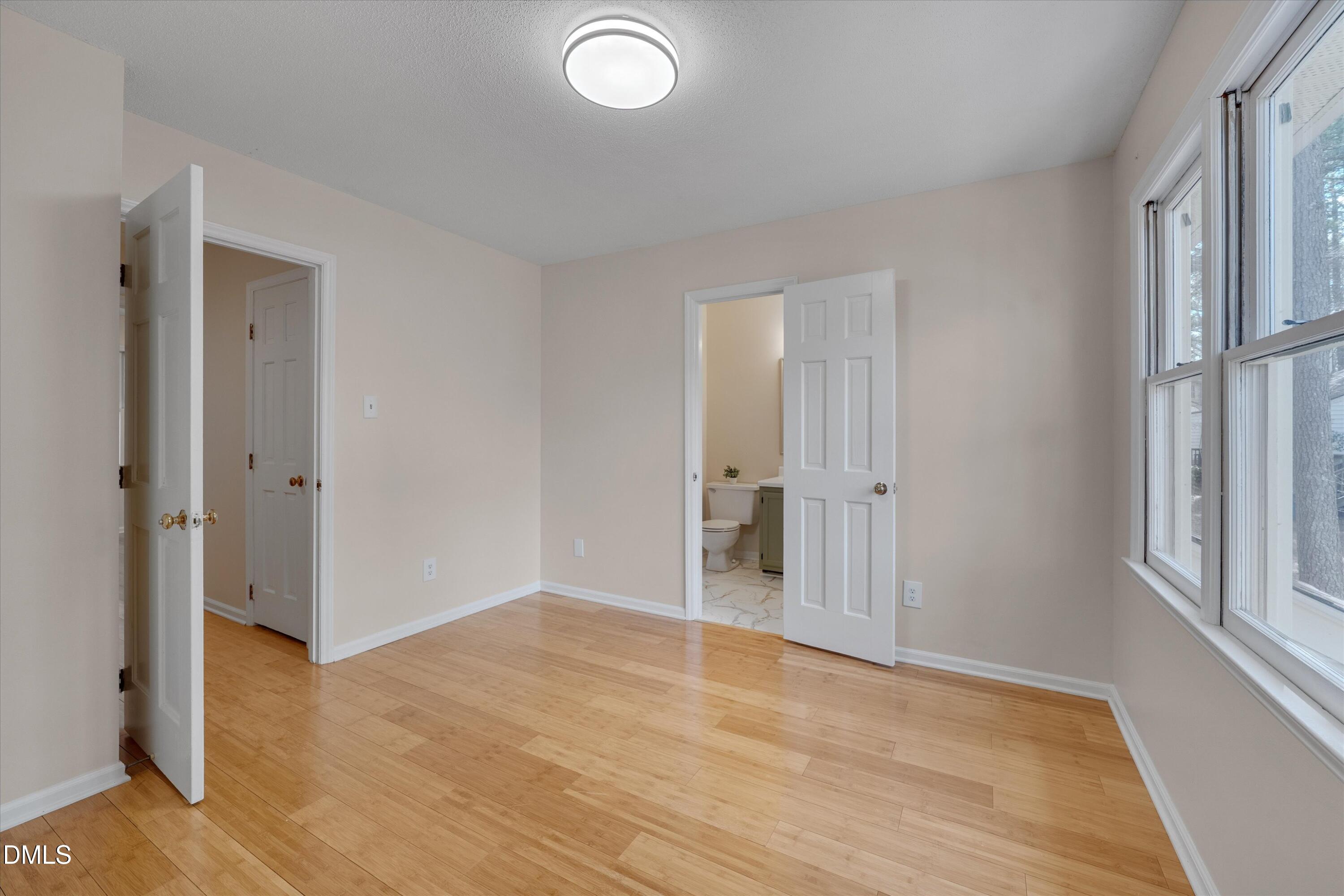 6528 Hearthstone Drive Raleigh, NC 27615 - Photo 22 of 32 wooden floor in an empty room