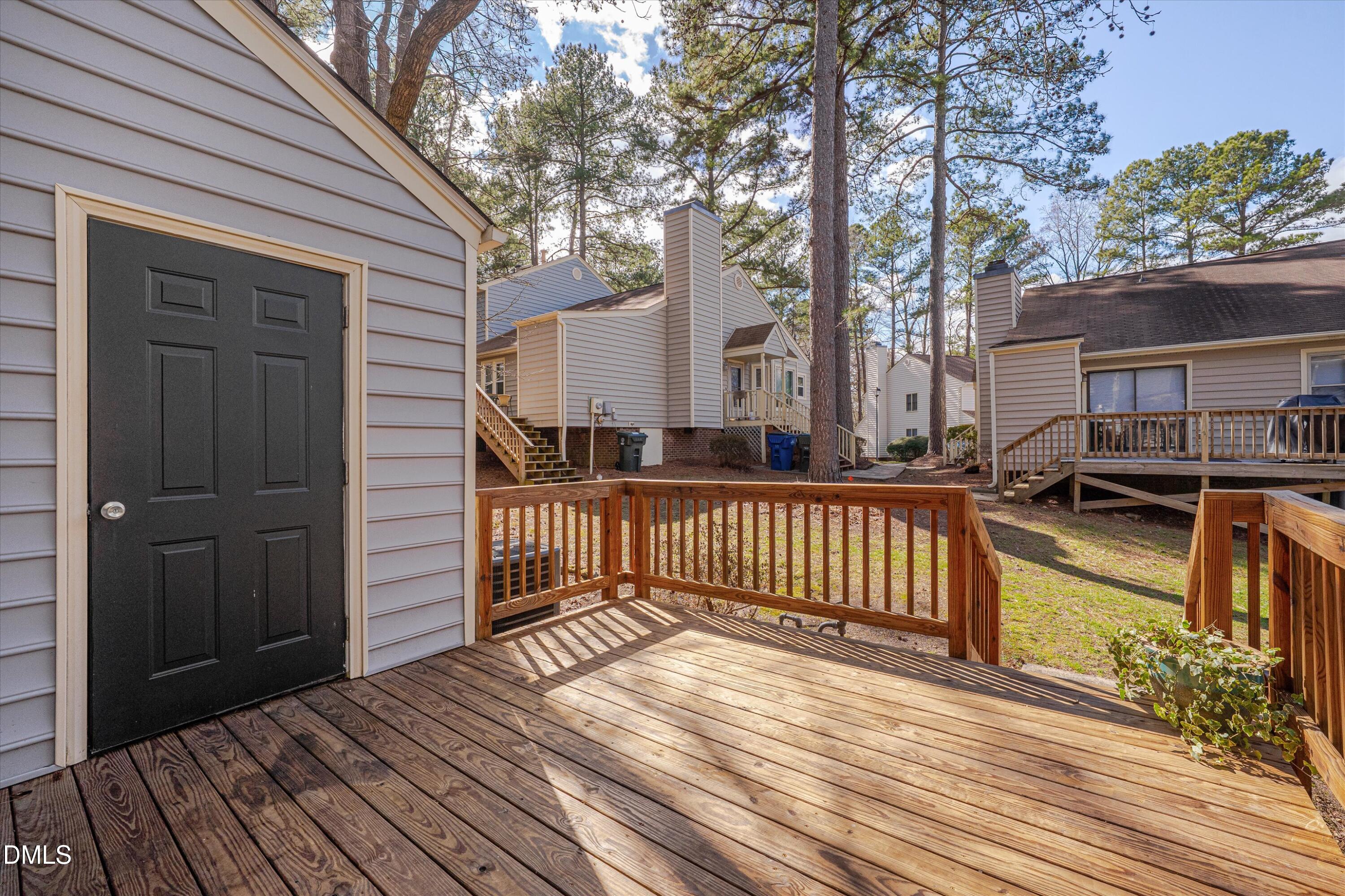 6528 Hearthstone Drive Raleigh, NC 27615 - Photo 26 of 32 a view of a house with wooden deck