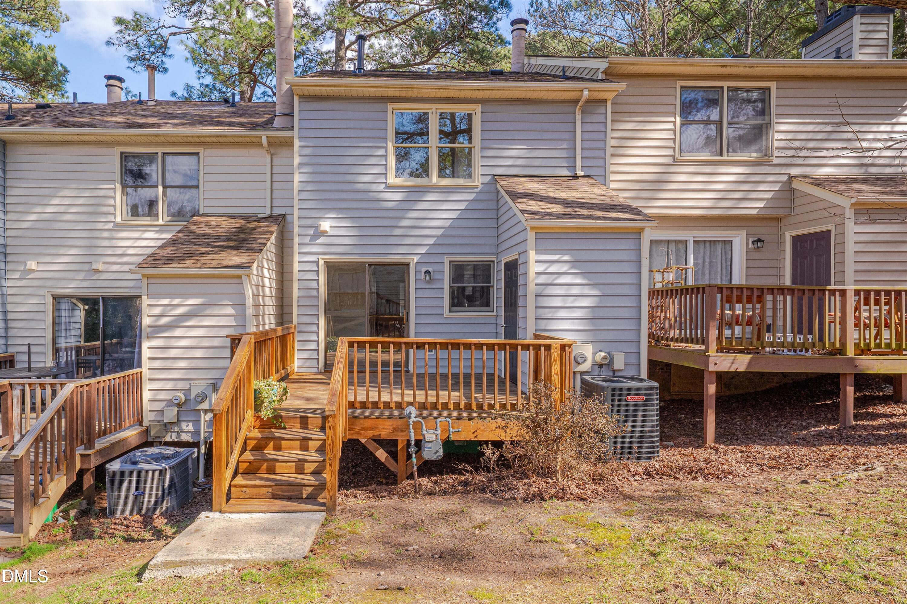 6528 Hearthstone Drive Raleigh, NC 27615 - Photo 28 of 32 a view of a house with a patio and a yard