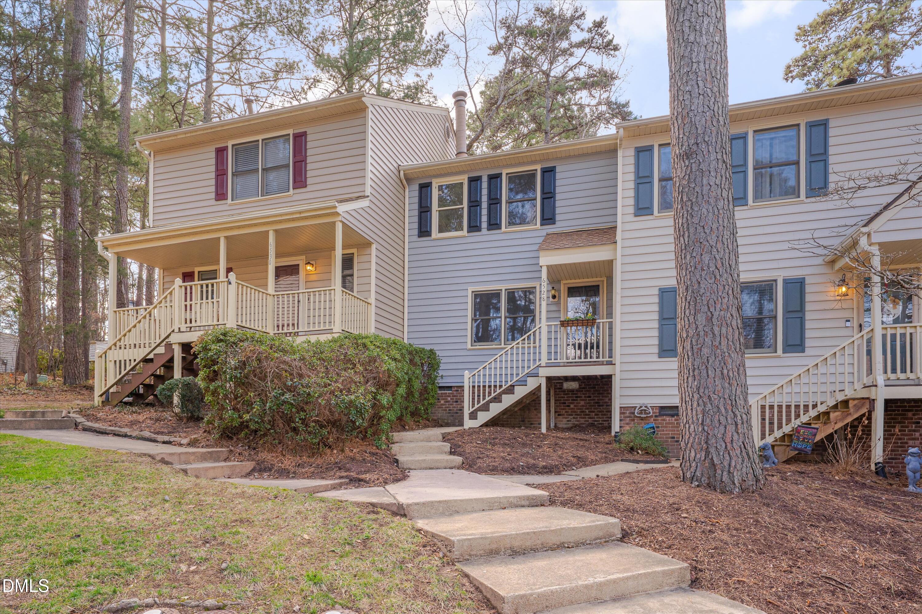 6528 Hearthstone Drive Raleigh, NC 27615 - Photo 2 of 32 a front view of a house with a yard