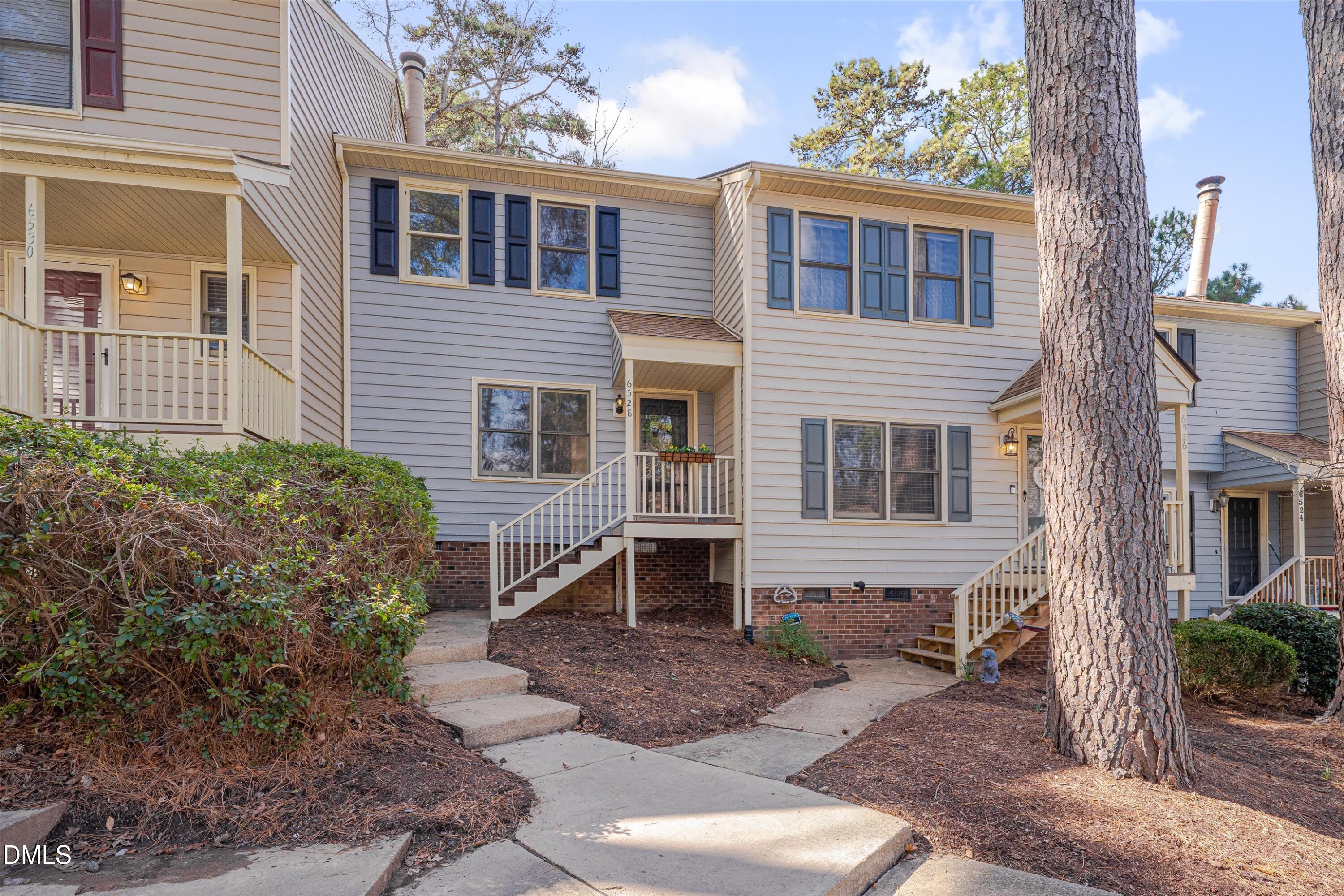 6528 Hearthstone Drive Raleigh, NC 27615 - Photo 3 of 32 a front view of a house with garden