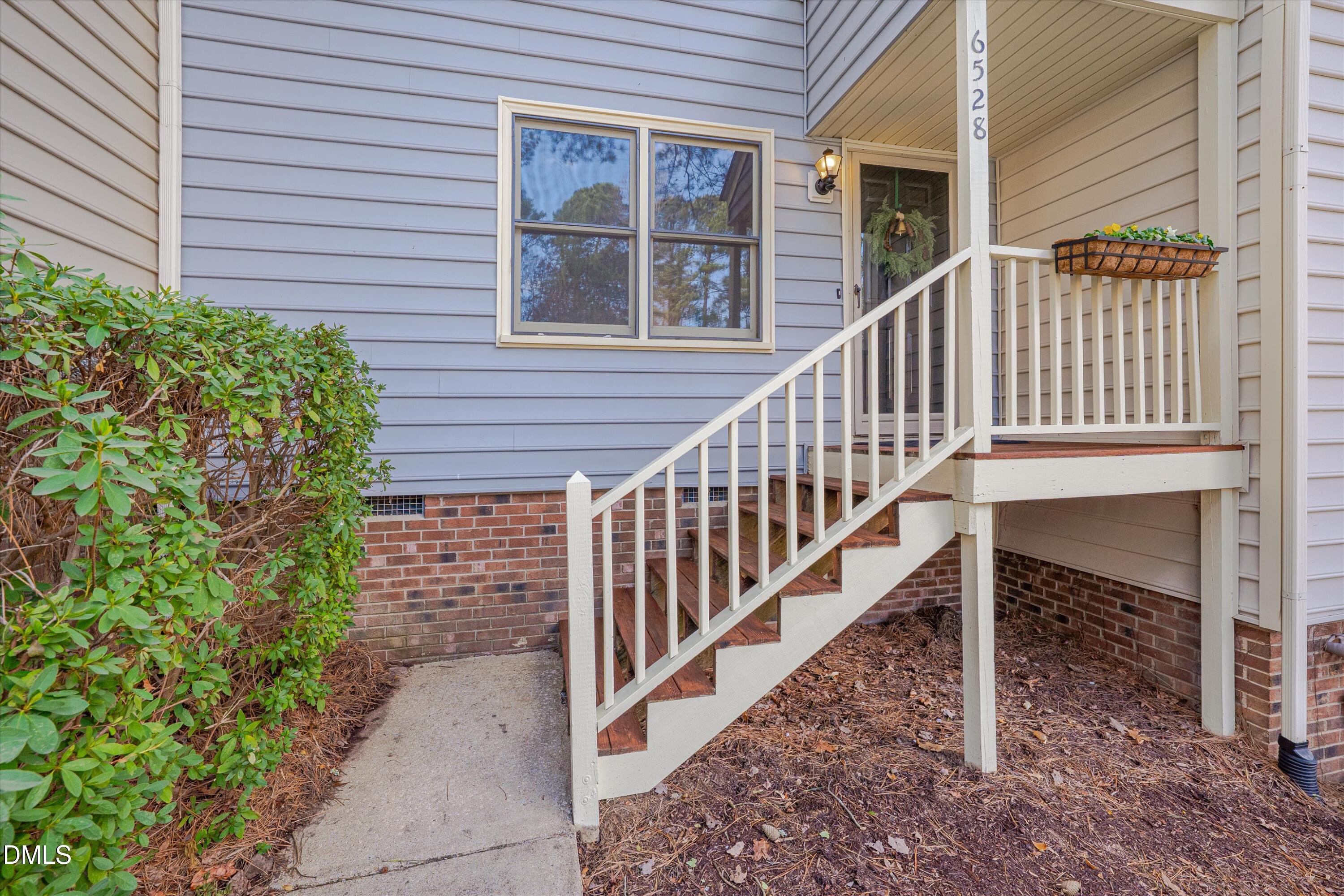 6528 Hearthstone Drive Raleigh, NC 27615 - Photo 4 of 32 a view of a house with backyard and deck