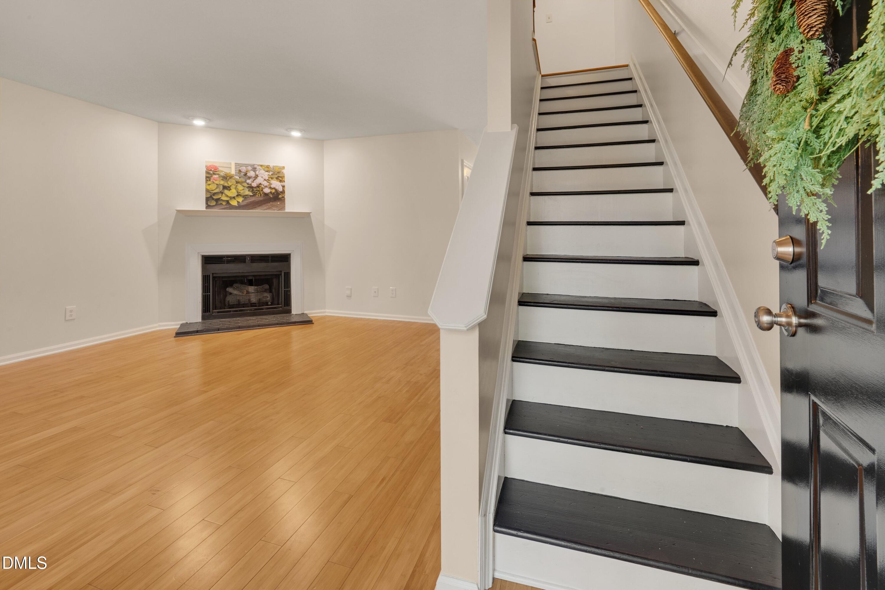 6528 Hearthstone Drive Raleigh, NC 27615 - Photo 6 of 32 a view of a room with stairs and wooden floor