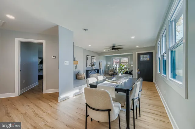 a view of a dining room with furniture wooden floor and a rug