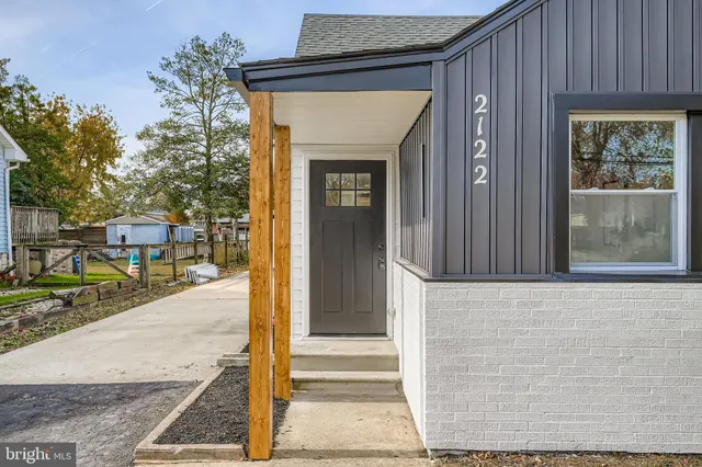 a front view of a house with a porch
