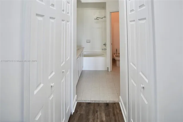a view of a bathroom from a hallway