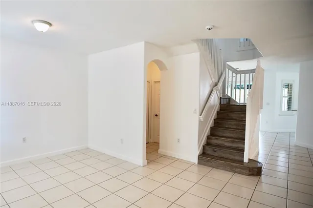 a view of an entryway with wooden floor