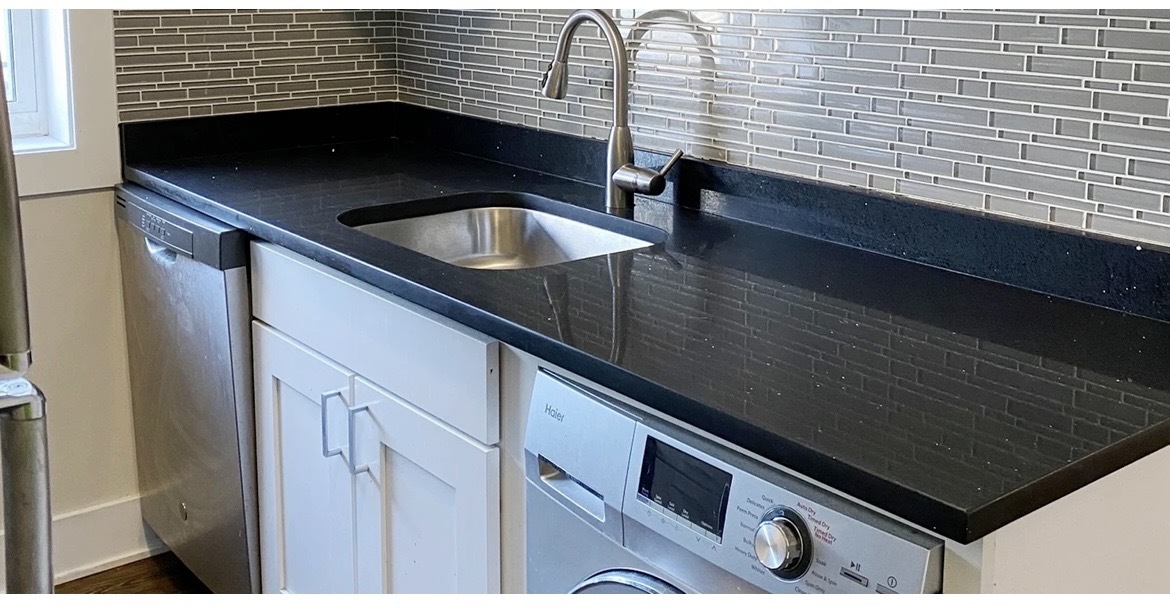 4218 North Clark Street, Unit 2 Chicago, IL 60613 - Photo 4 of 12 a kitchen with a sink and cabinets