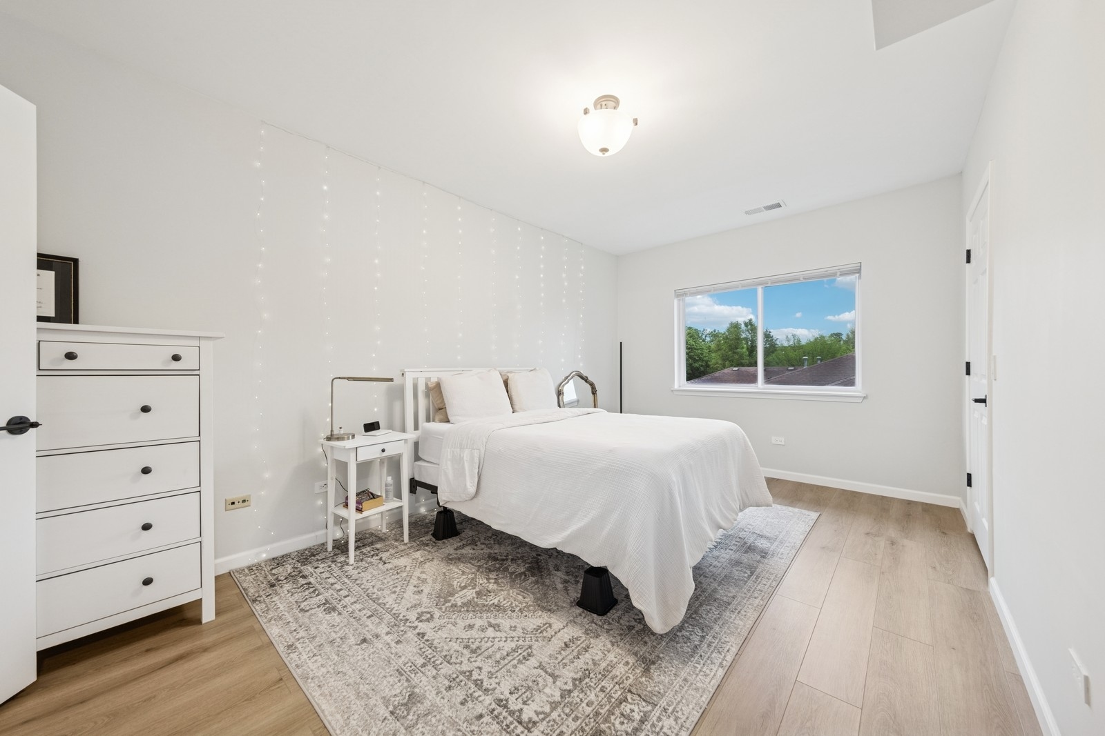 943 Elderberry Circle, Unit 303 Naperville, IL 60563 - Photo 12 of 19 a bedroom with a bed and a window