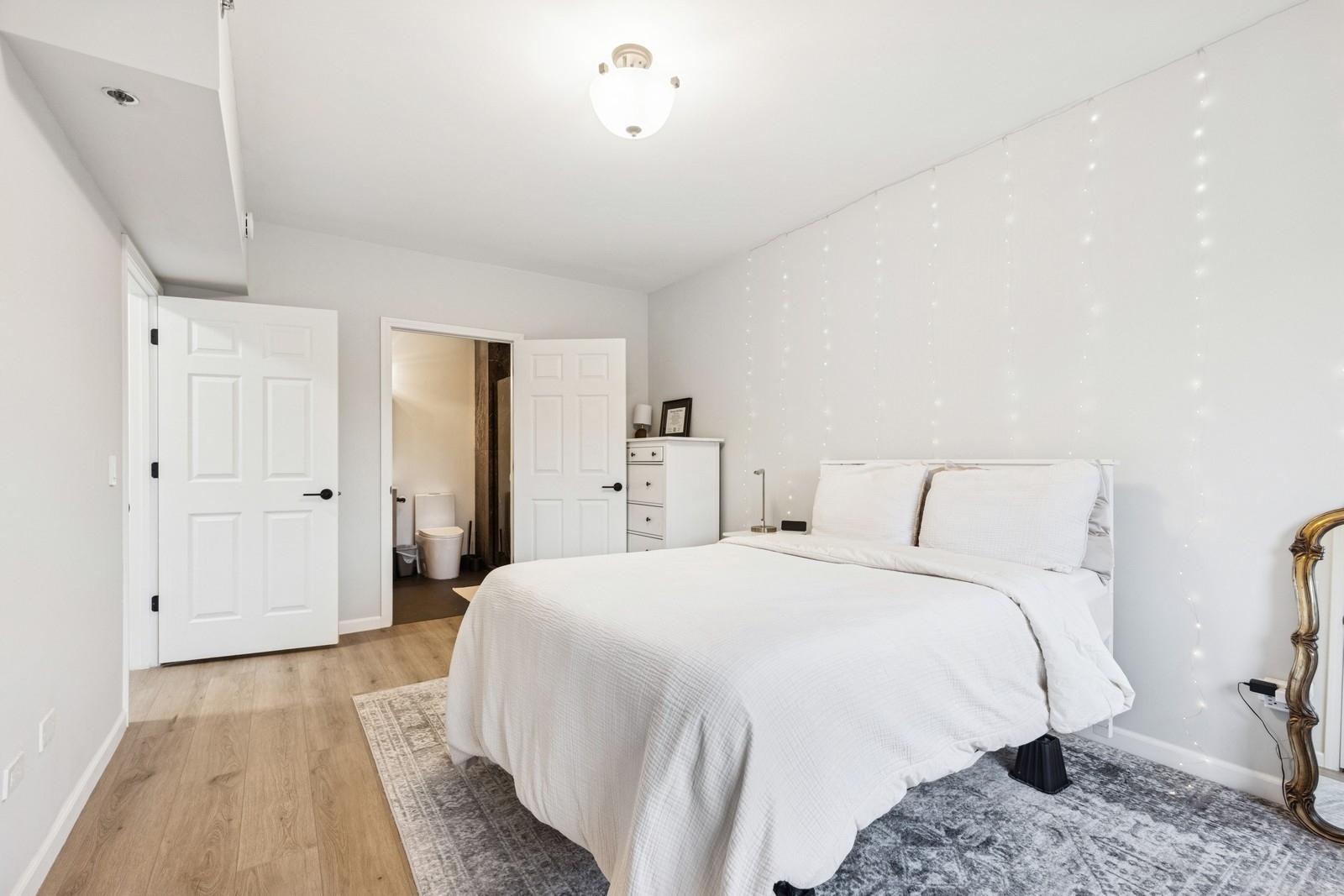 943 Elderberry Circle, Unit 303 Naperville, IL 60563 - Photo 13 of 19 a bedroom with a bed and a dresser