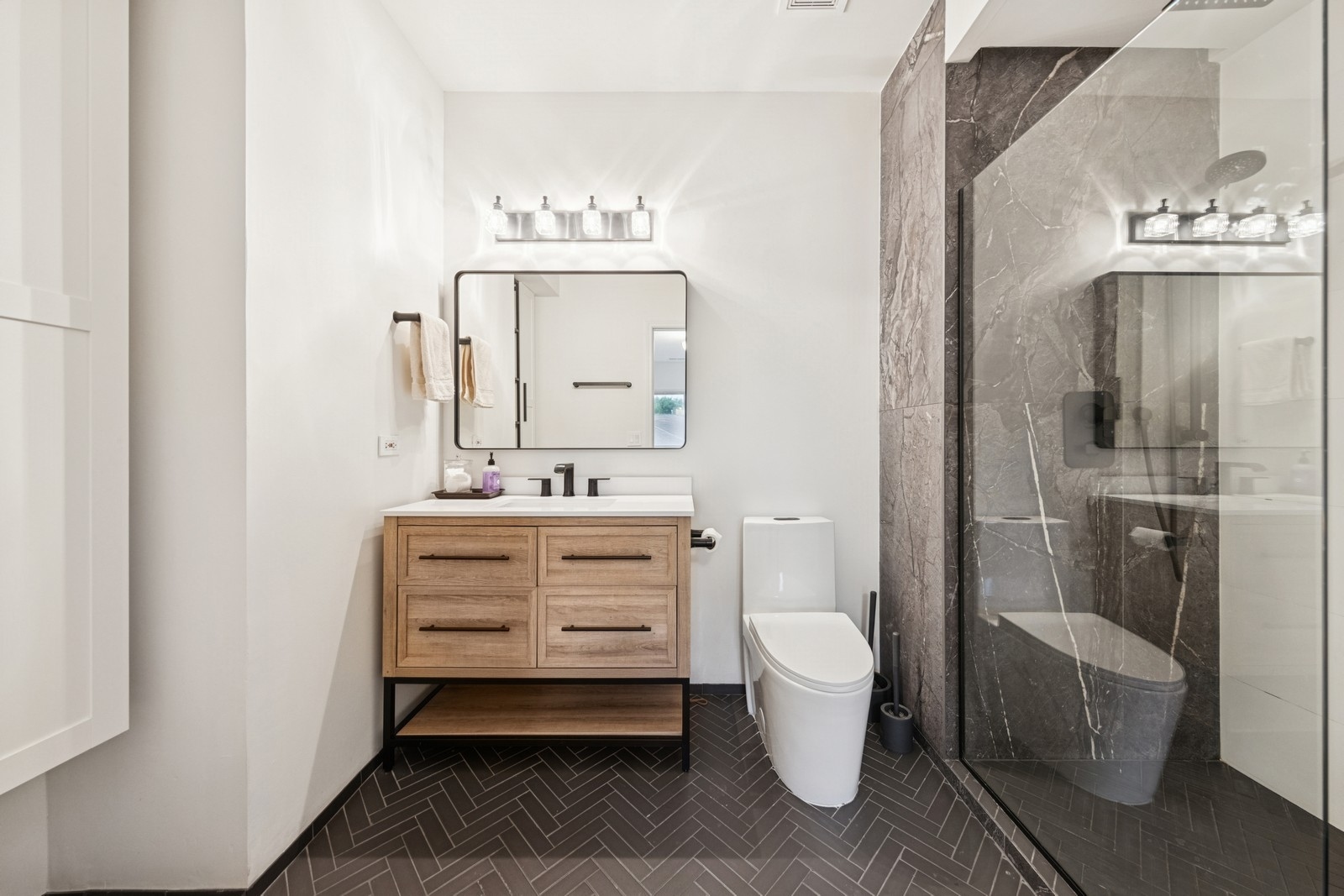 943 Elderberry Circle, Unit 303 Naperville, IL 60563 - Photo 14 of 19 a bathroom with a sink toilet and shower