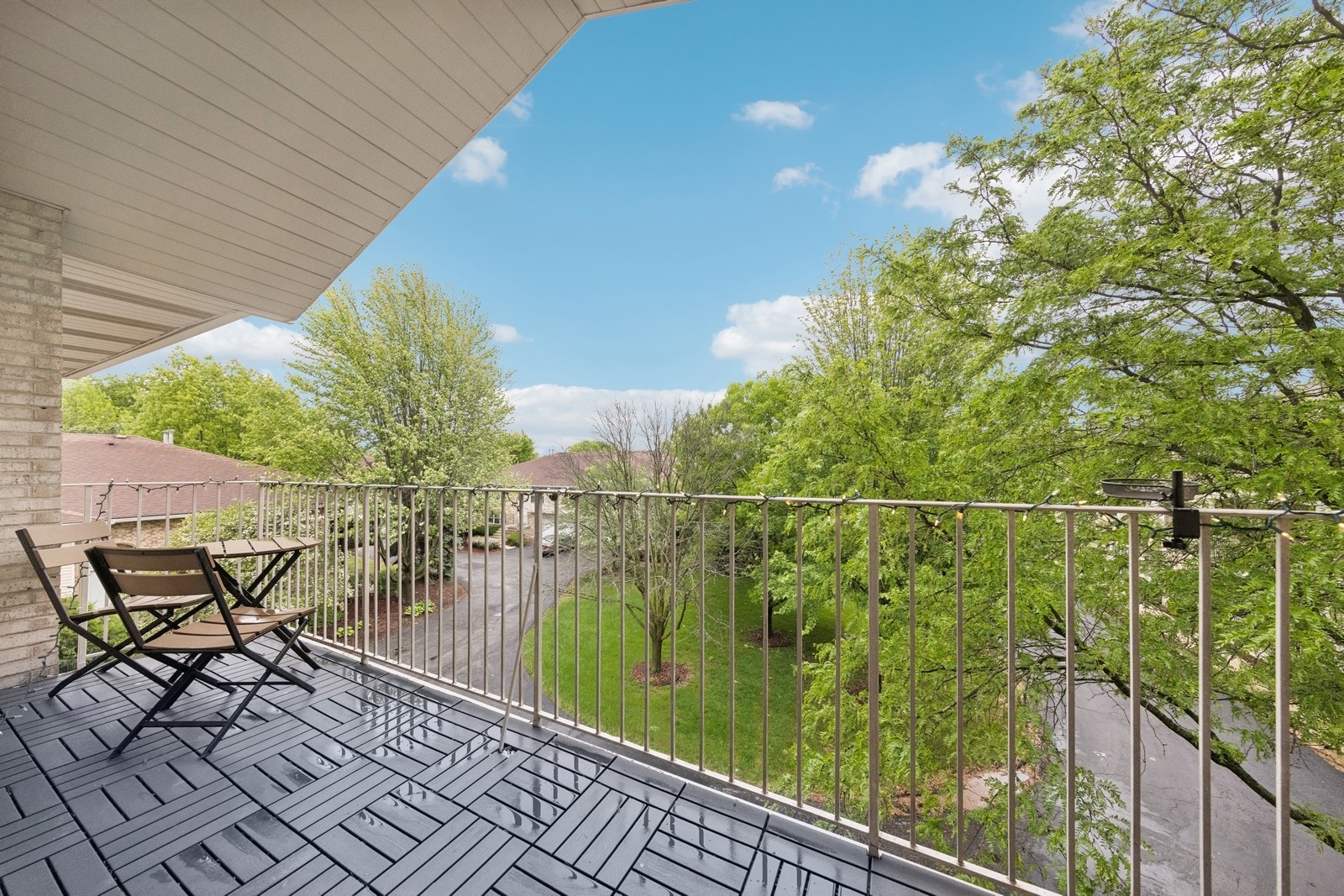 943 Elderberry Circle, Unit 303 Naperville, IL 60563 - Photo 15 of 19 a view of a balcony with chairs