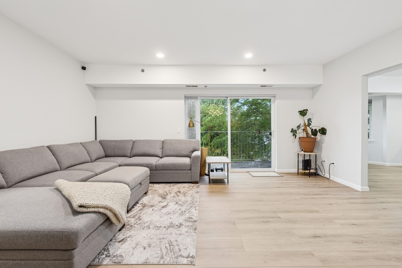 943 Elderberry Circle, Unit 303 Naperville, IL 60563 - Photo 2 of 19 a living room with furniture and large window