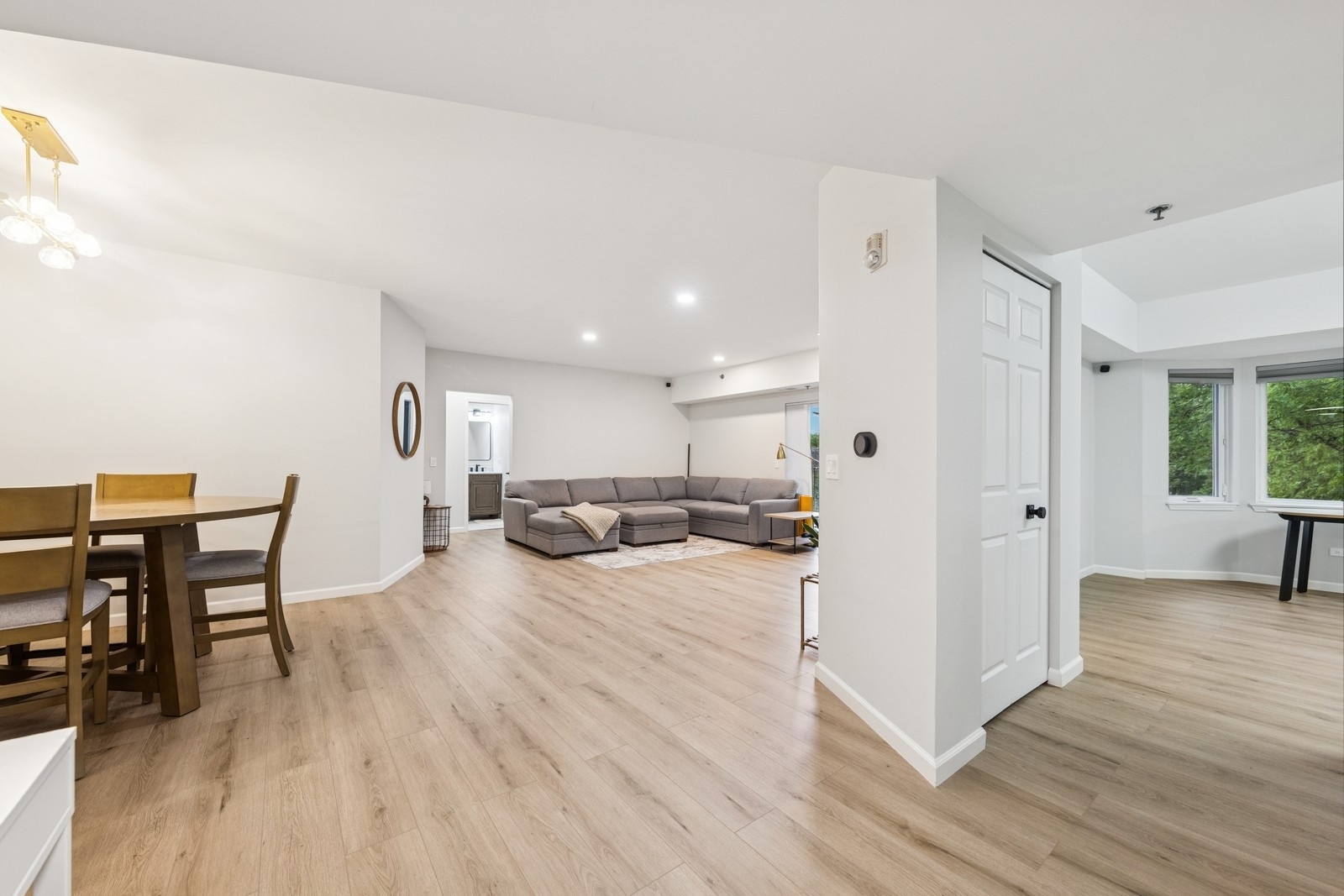 943 Elderberry Circle, Unit 303 Naperville, IL 60563 - Photo 3 of 19 a living room with furniture and a wooden floor