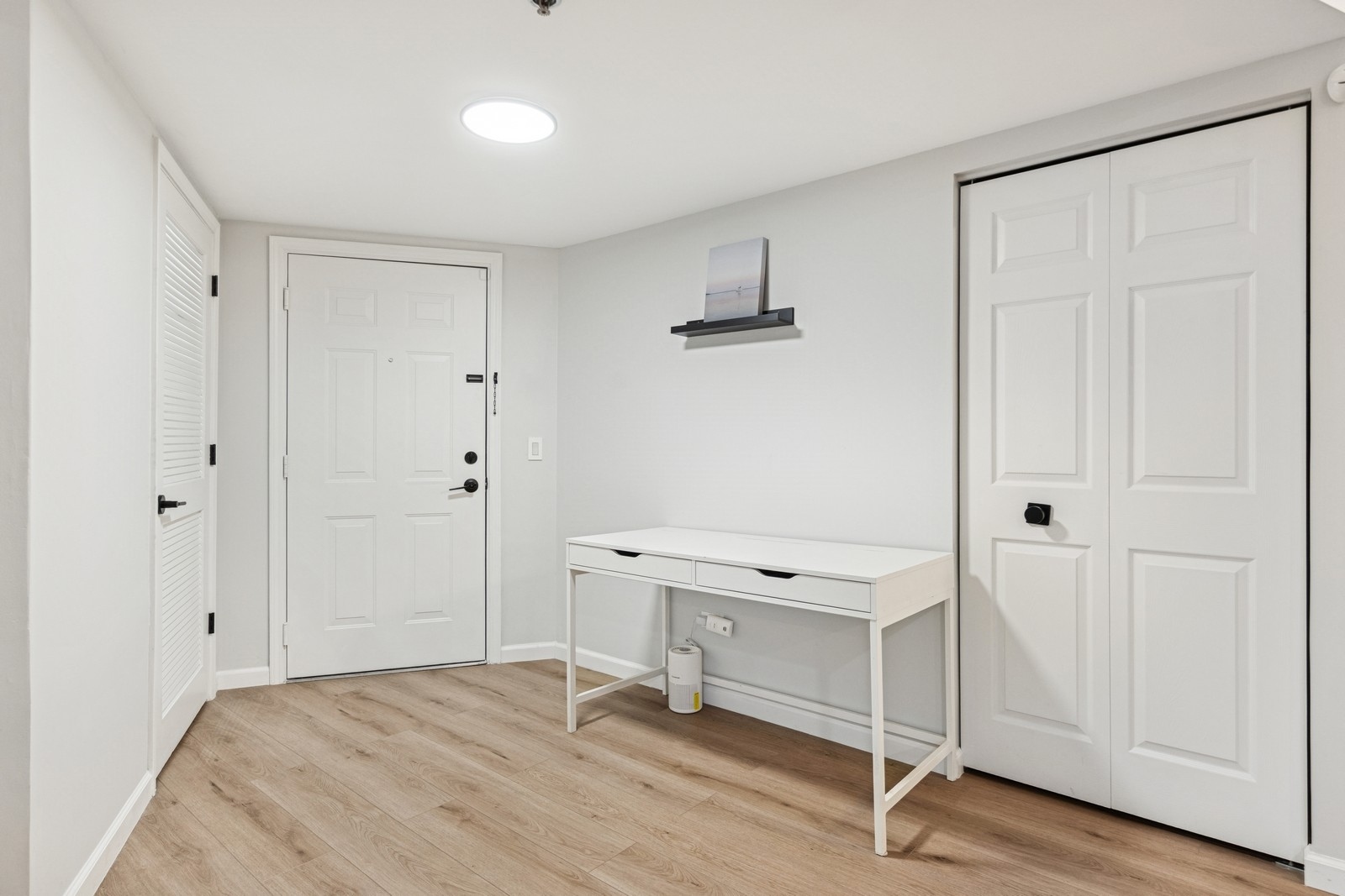 943 Elderberry Circle, Unit 303 Naperville, IL 60563 - Photo 4 of 19 a room that has a bed and a table in it