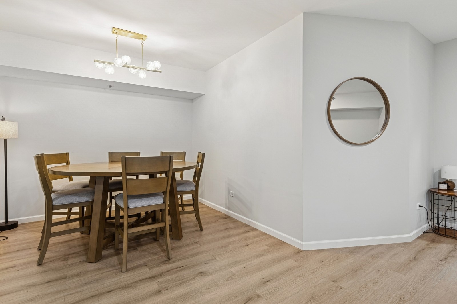 943 Elderberry Circle, Unit 303 Naperville, IL 60563 - Photo 6 of 19 a view of a dining room with furniture and wooden floor