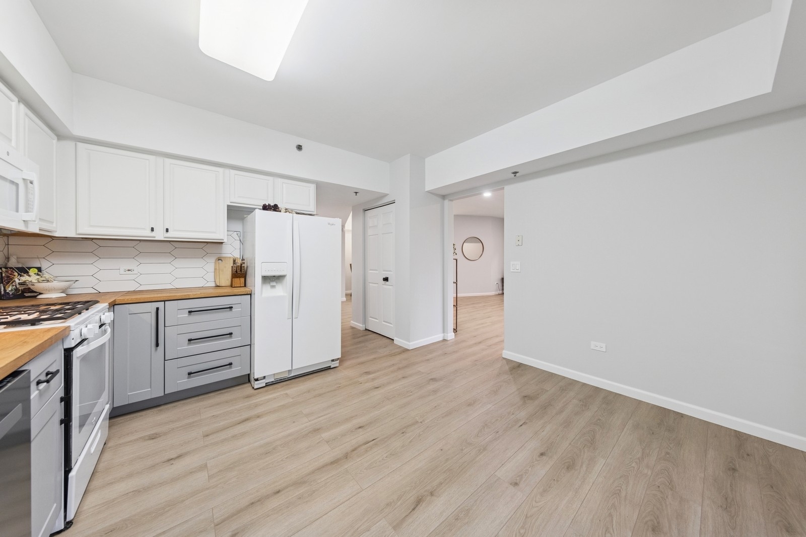 943 Elderberry Circle, Unit 303 Naperville, IL 60563 - Photo 8 of 19 a view of kitchen with wooden floor and electronic appliances