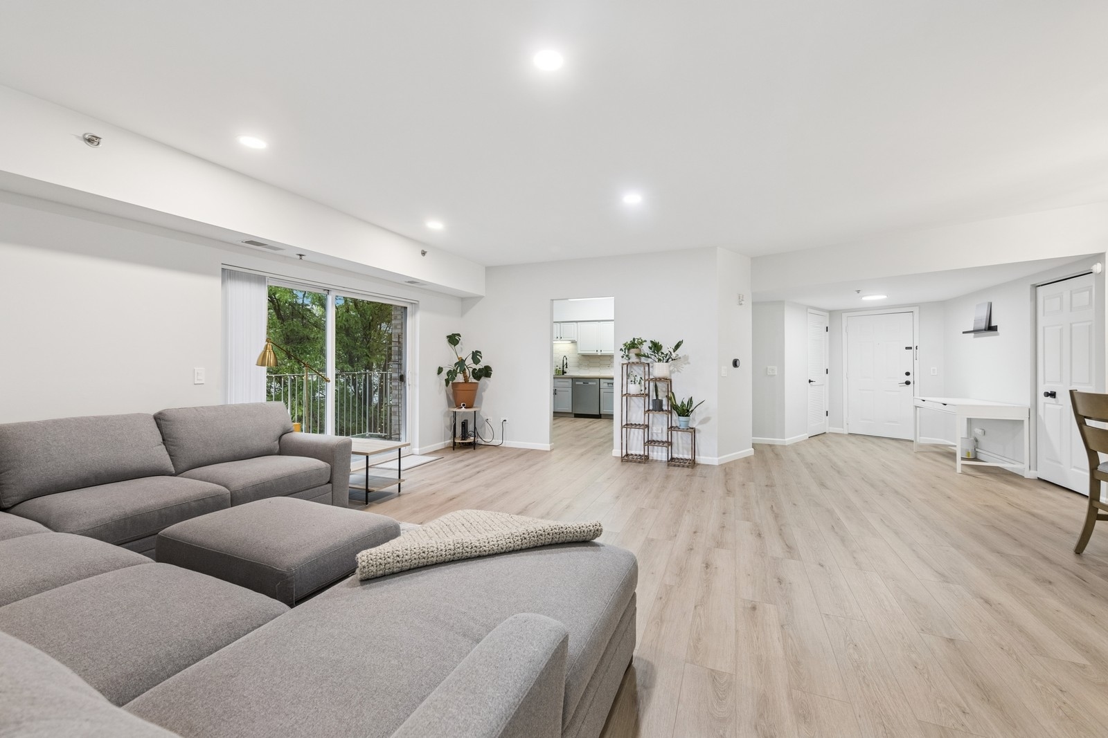 943 Elderberry Circle, Unit 303 Naperville, IL 60563 - Photo 9 of 19 a living room with furniture and a wooden floor