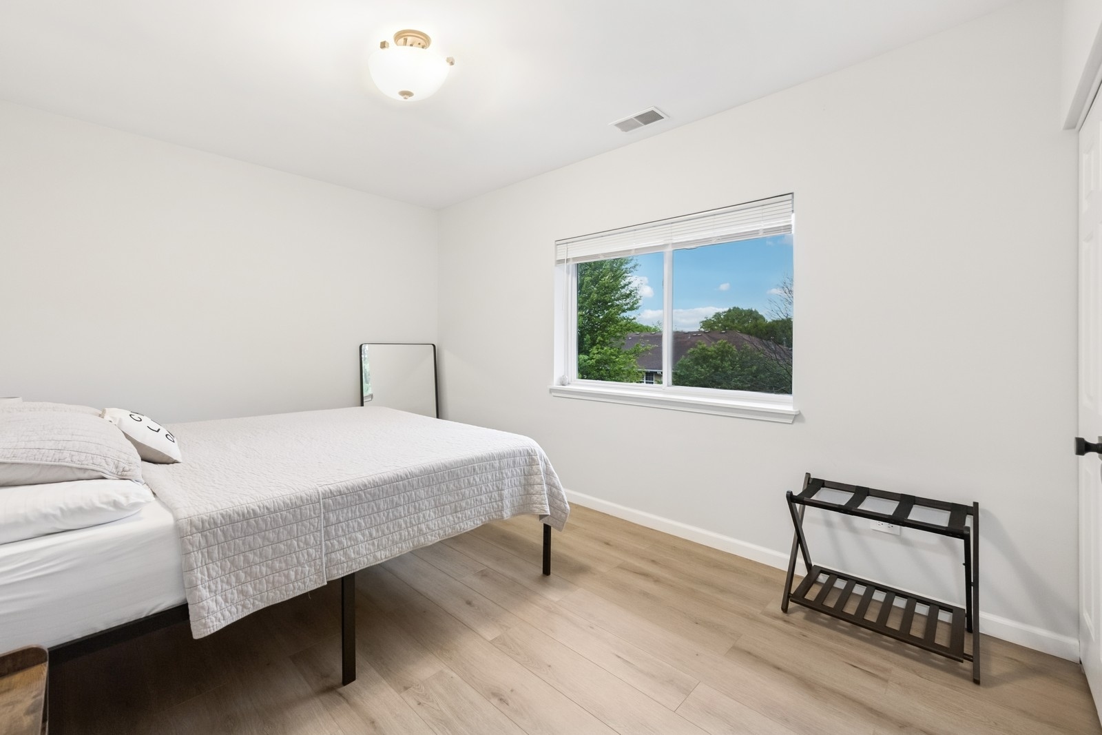 943 Elderberry Circle, Unit 303 Naperville, IL 60563 - Photo 10 of 19 a bedroom with a bed and a window