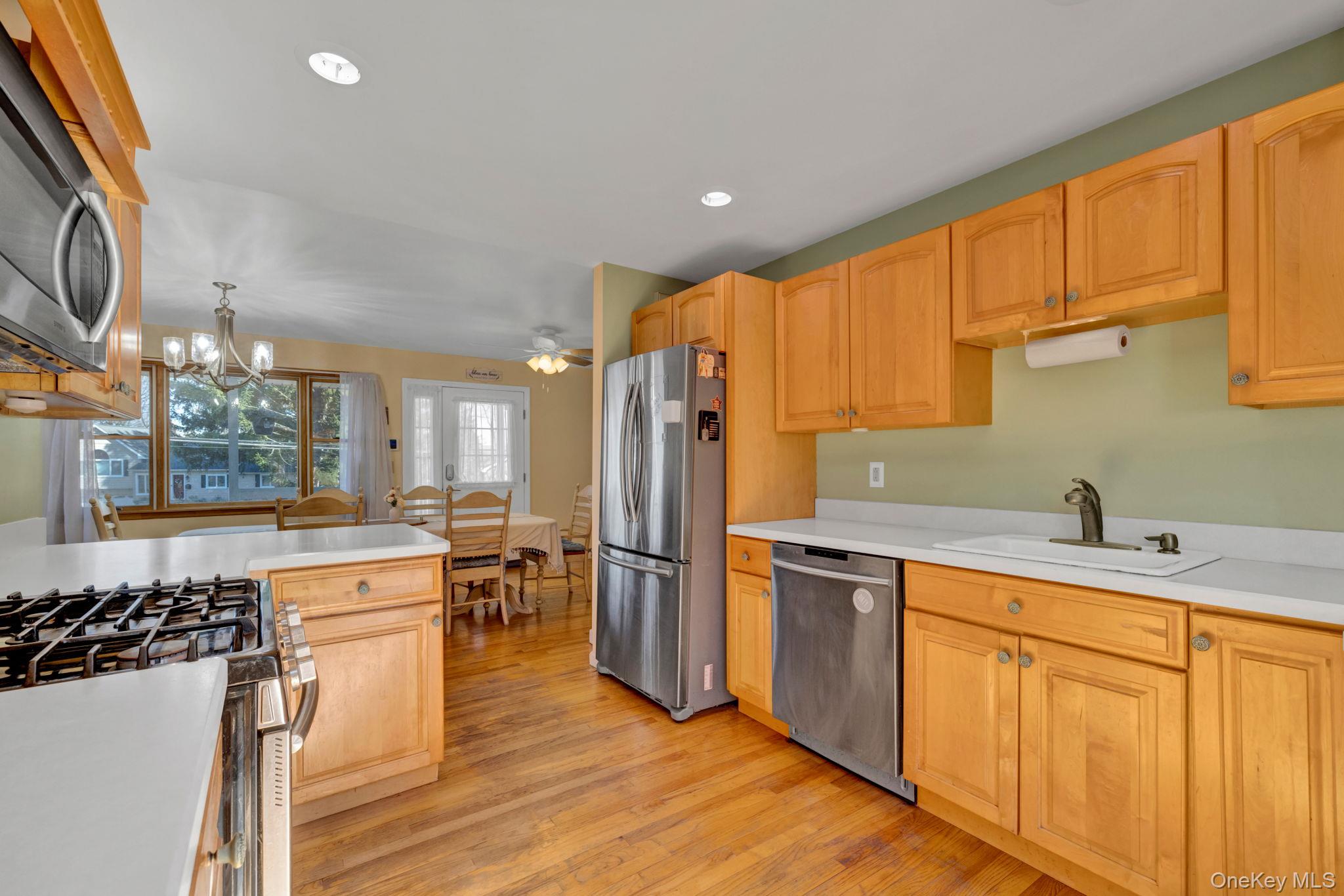 65 Jay Street Stony Point, NY 10980 - Photo 12 of 32 a kitchen with stainless steel appliances granite countertop a sink stove and refrigerator