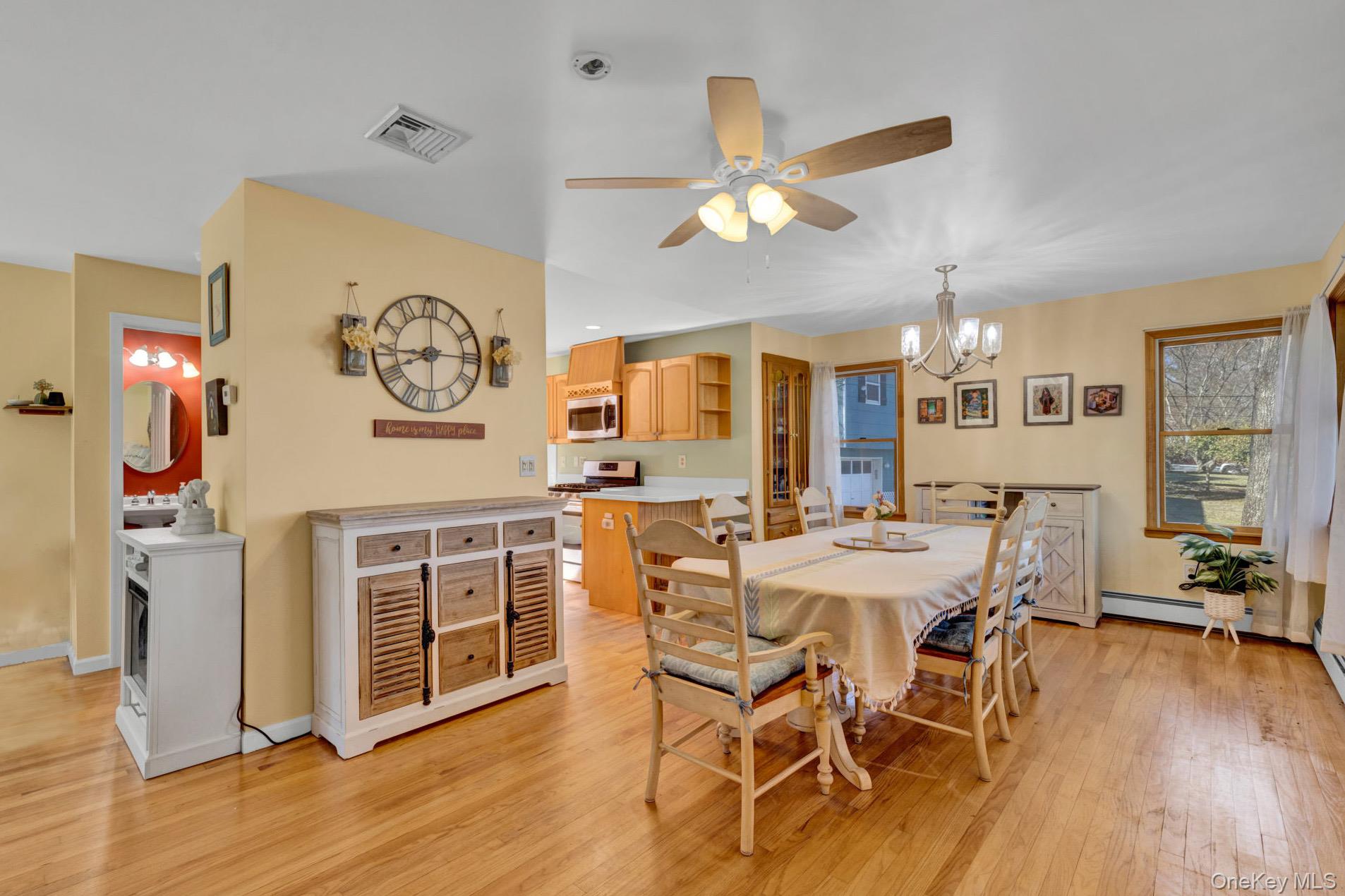 65 Jay Street Stony Point, NY 10980 - Photo 18 of 32 a view of a dining room with furniture a kitchen and chandelier