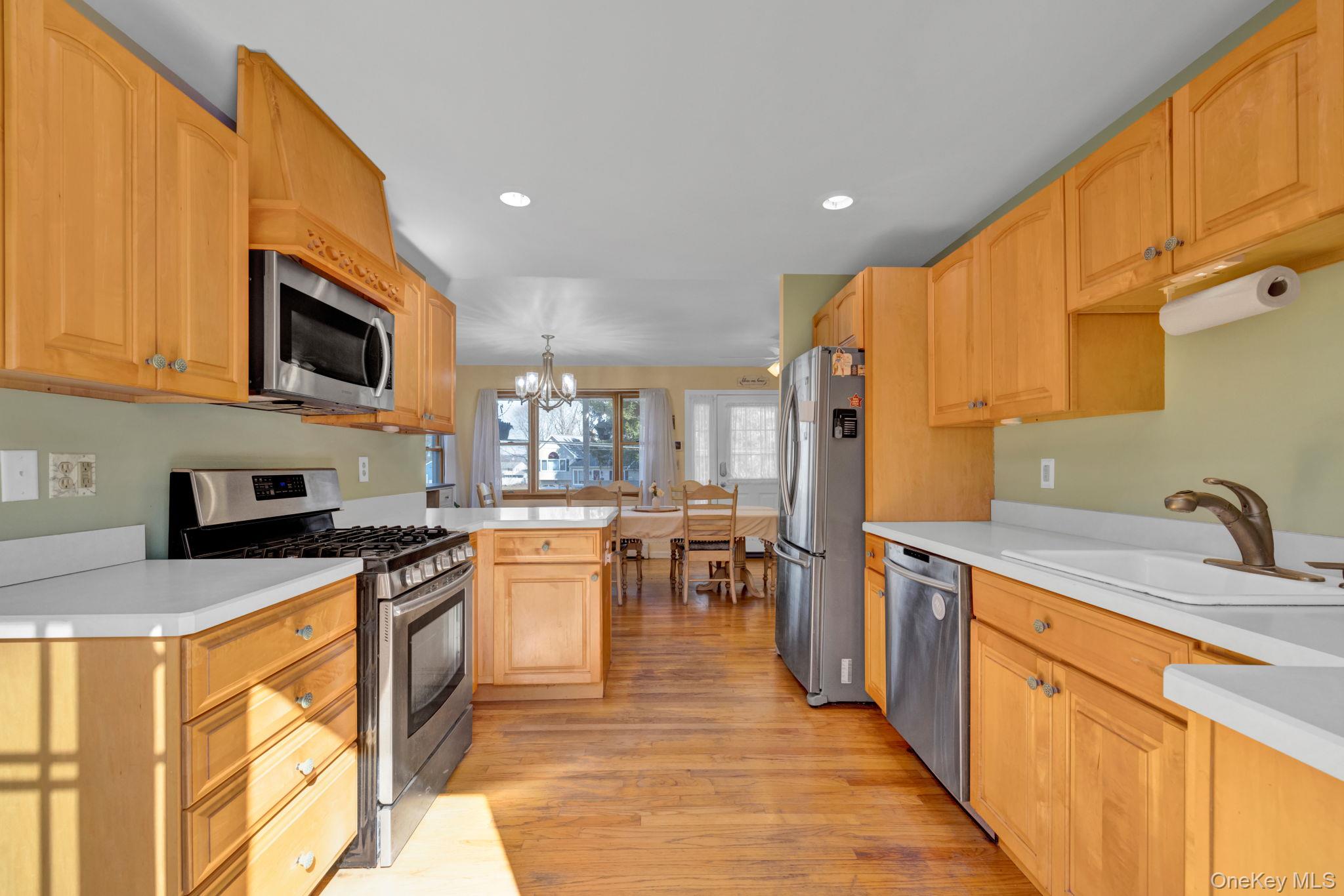 65 Jay Street Stony Point, NY 10980 - Photo 2 of 32 a kitchen with stainless steel appliances granite countertop wooden cabinets a sink dishwasher a stove and a refrigerator