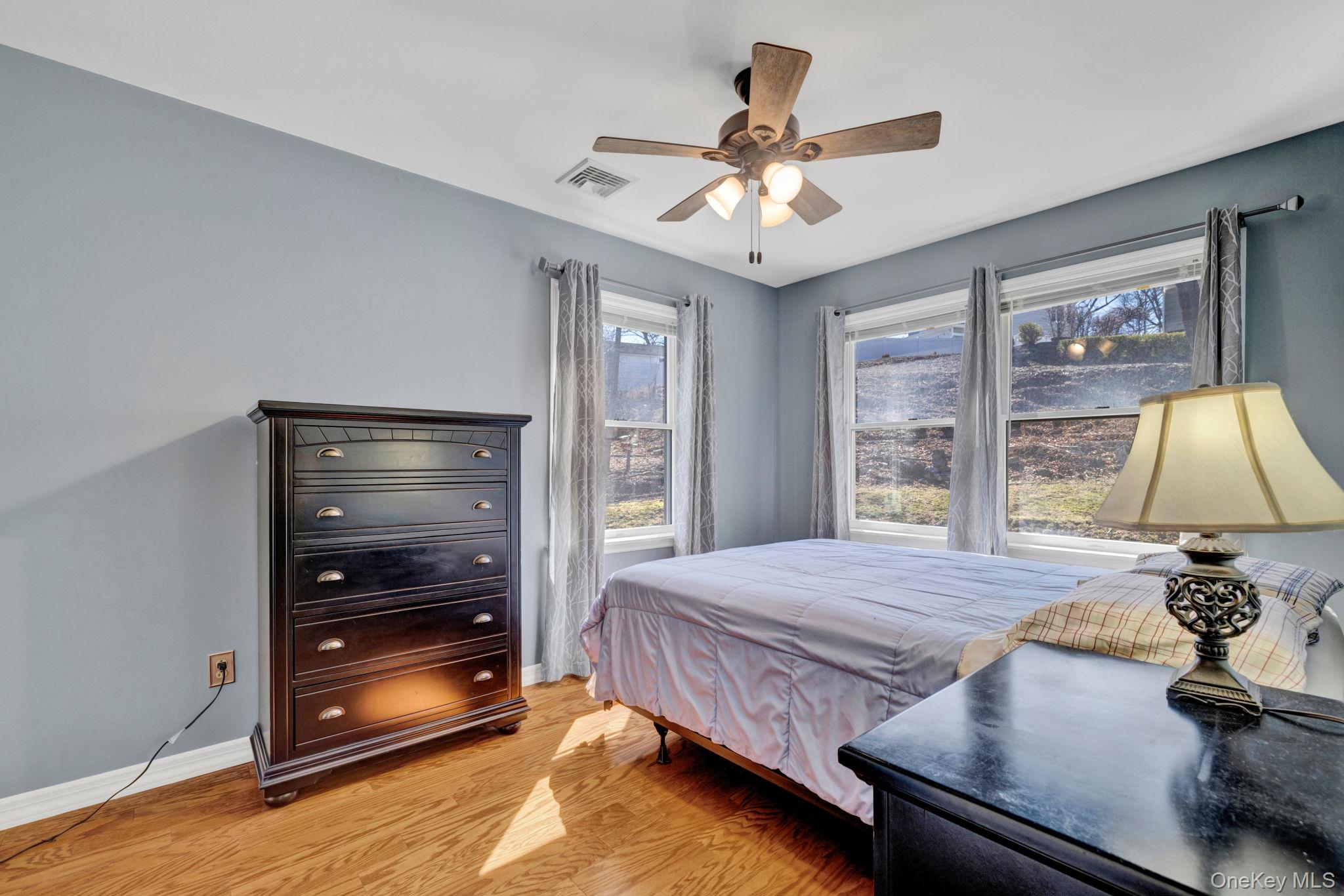 65 Jay Street Stony Point, NY 10980 - Photo 22 of 32 a bedroom with a bed and a flat tv screen on dresser