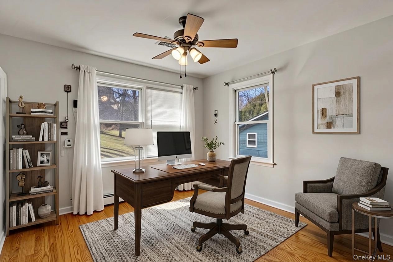 65 Jay Street Stony Point, NY 10980 - Photo 27 of 32 a view of a workspace with furniture and a bookshelf