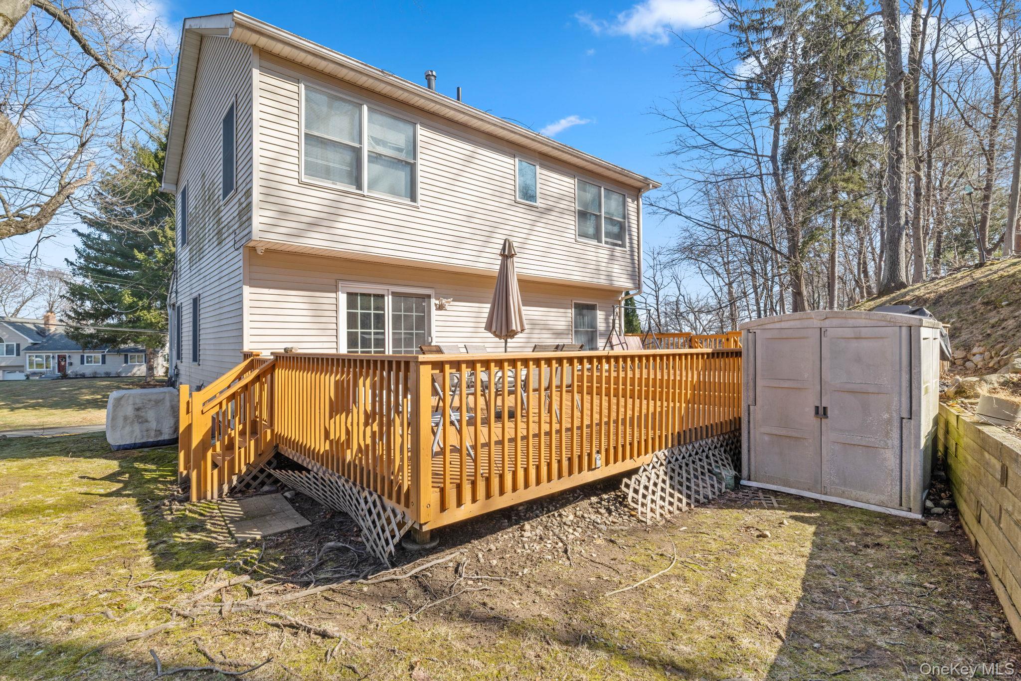 65 Jay Street Stony Point, NY 10980 - Photo 9 of 32 a view of backyard with a deck and swimming pool