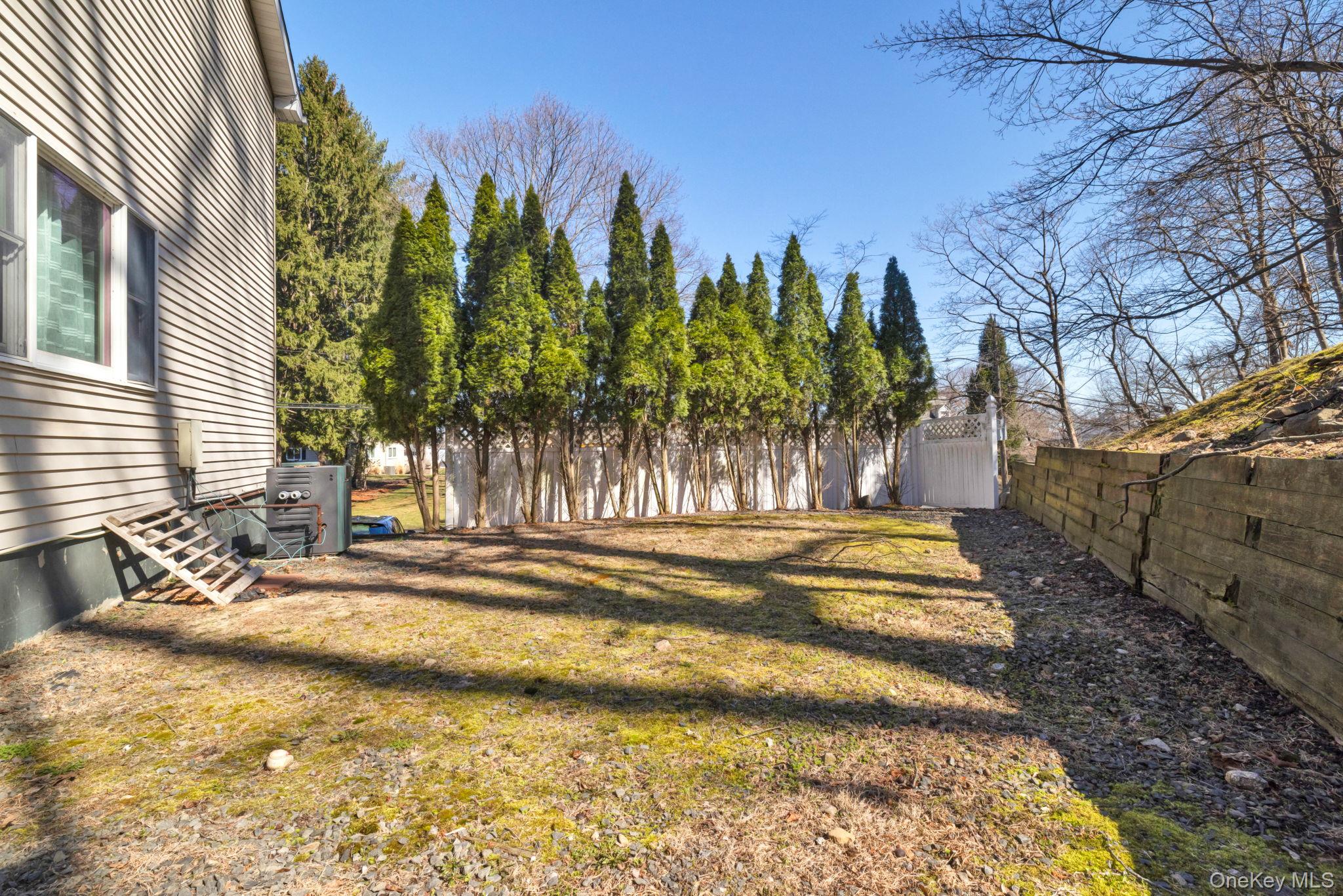 65 Jay Street Stony Point, NY 10980 - Photo 10 of 32 a view of a yard is middle in the backyard
