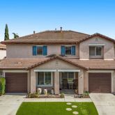 a front view of a house with yard