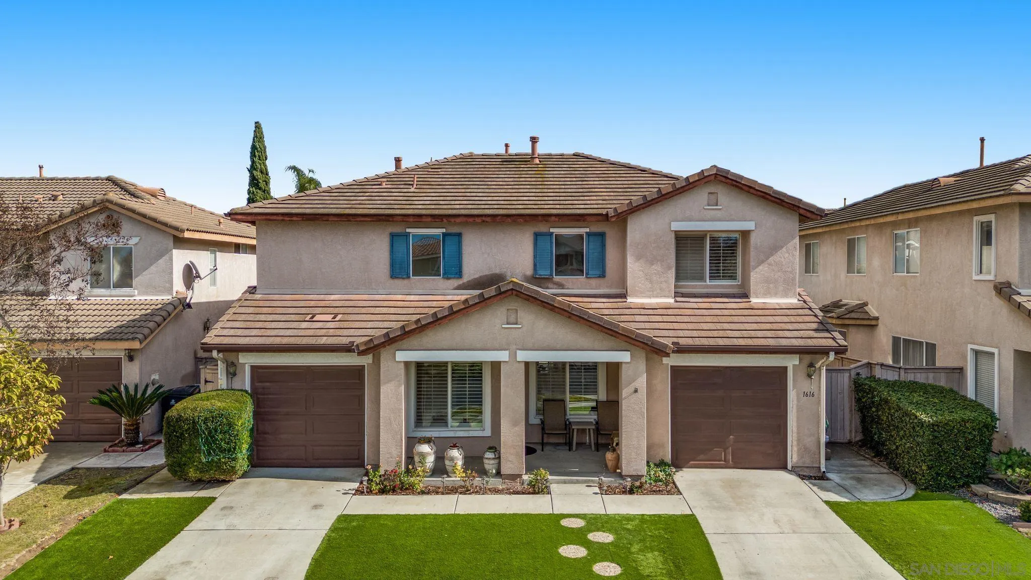 a front view of a house with yard