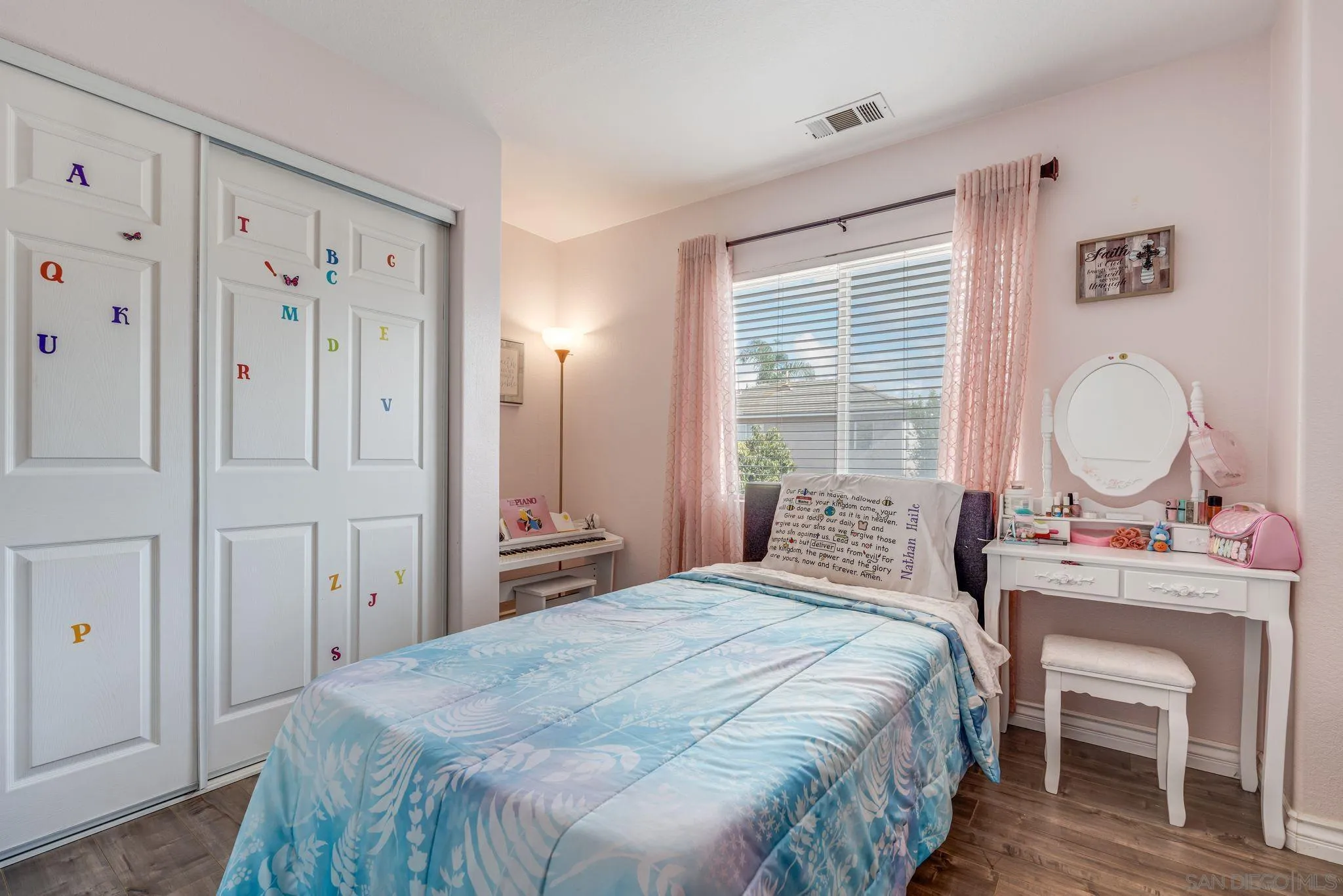 1616 Gold Run Road Chula Vista, CA 91913 - Photo 28 of 35 a bedroom with a bed dresser and a window