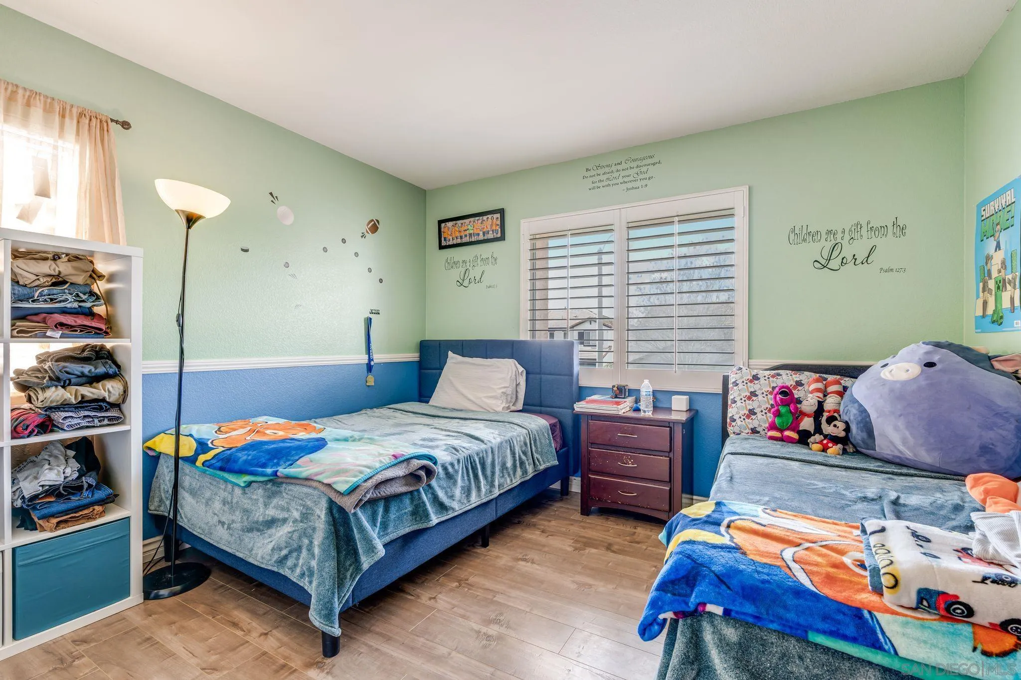 1616 Gold Run Road Chula Vista, CA 91913 - Photo 30 of 35 a bedroom with a bed and a window