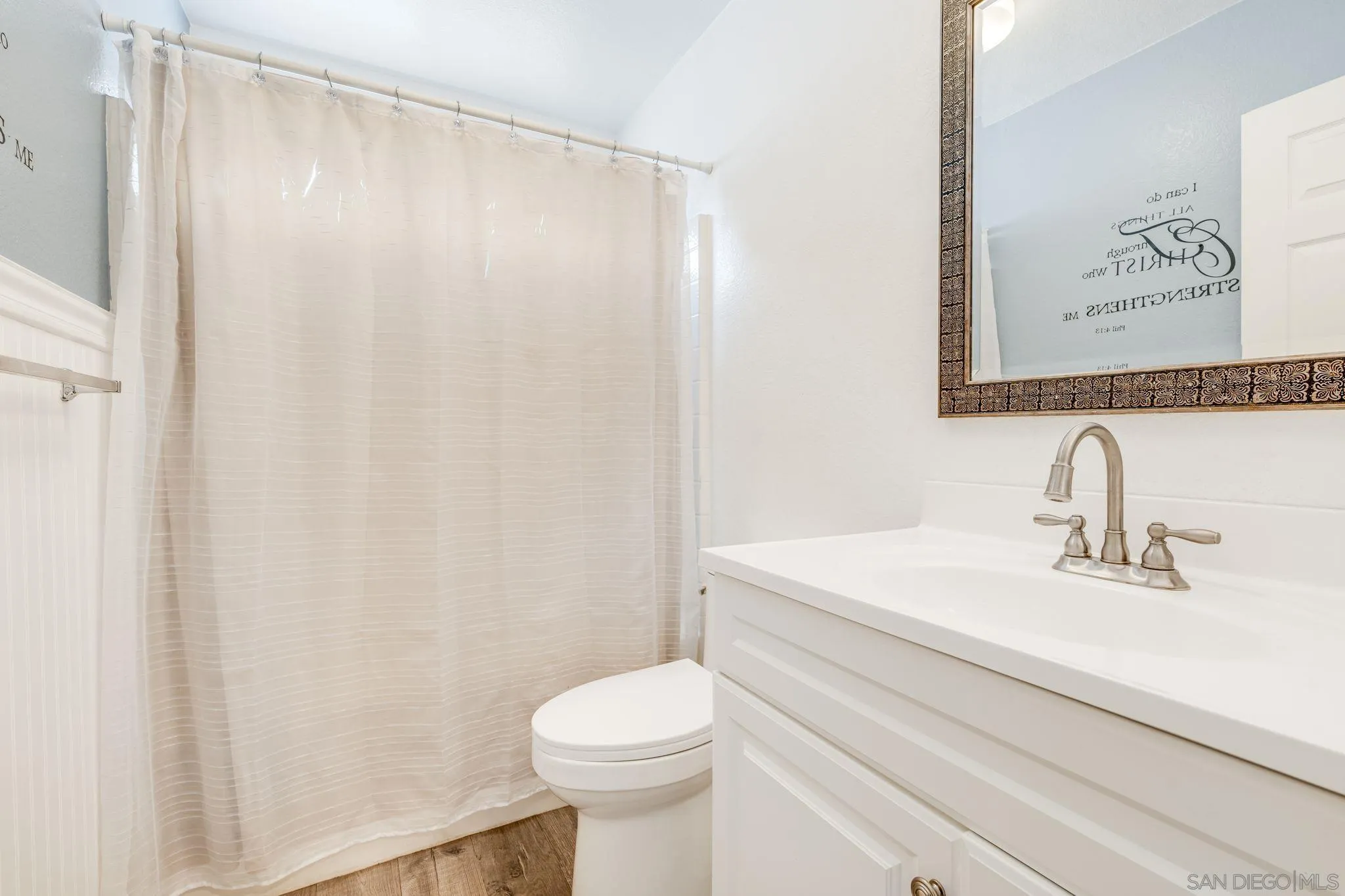 1616 Gold Run Road Chula Vista, CA 91913 - Photo 34 of 35 a bathroom with a sink a toilet and a mirror