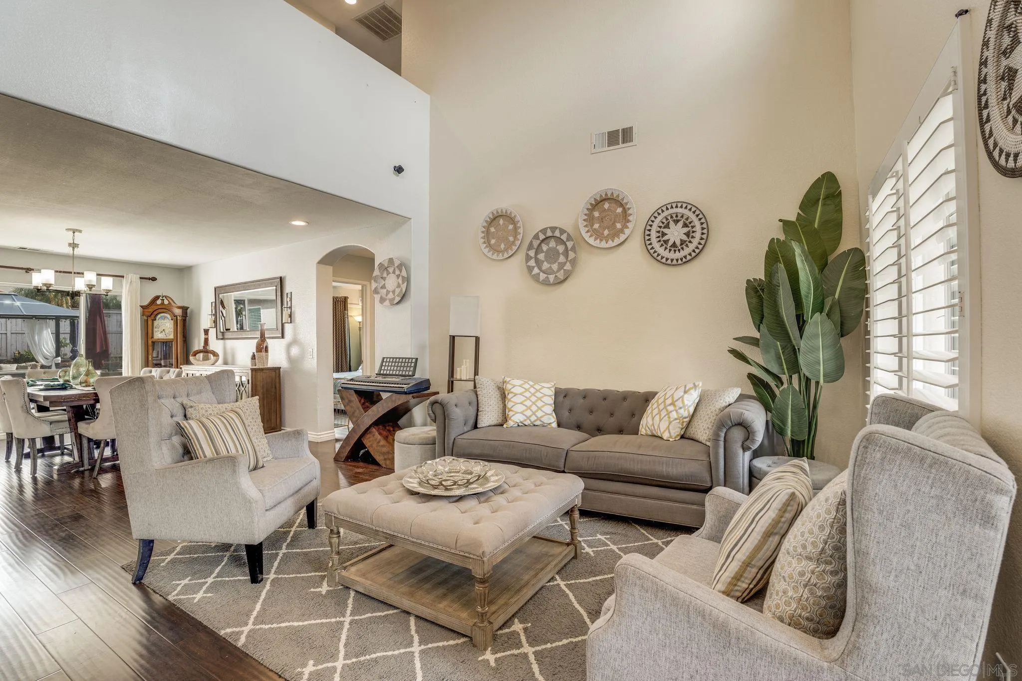 1616 Gold Run Road Chula Vista, CA 91913 - Photo 4 of 35 a living room with furniture a table and a clock