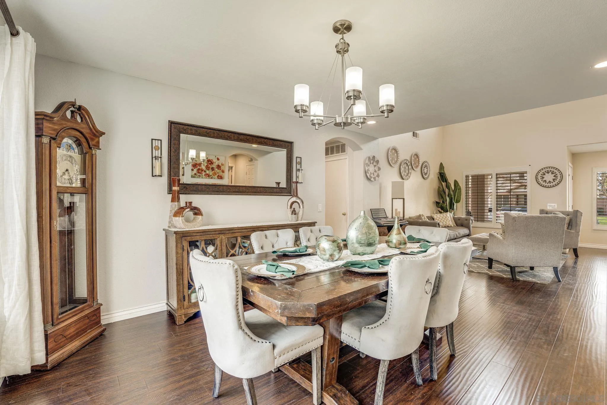 1616 Gold Run Road Chula Vista, CA 91913 - Photo 6 of 35 a view of a dining room with furniture wooden floor and chandelier