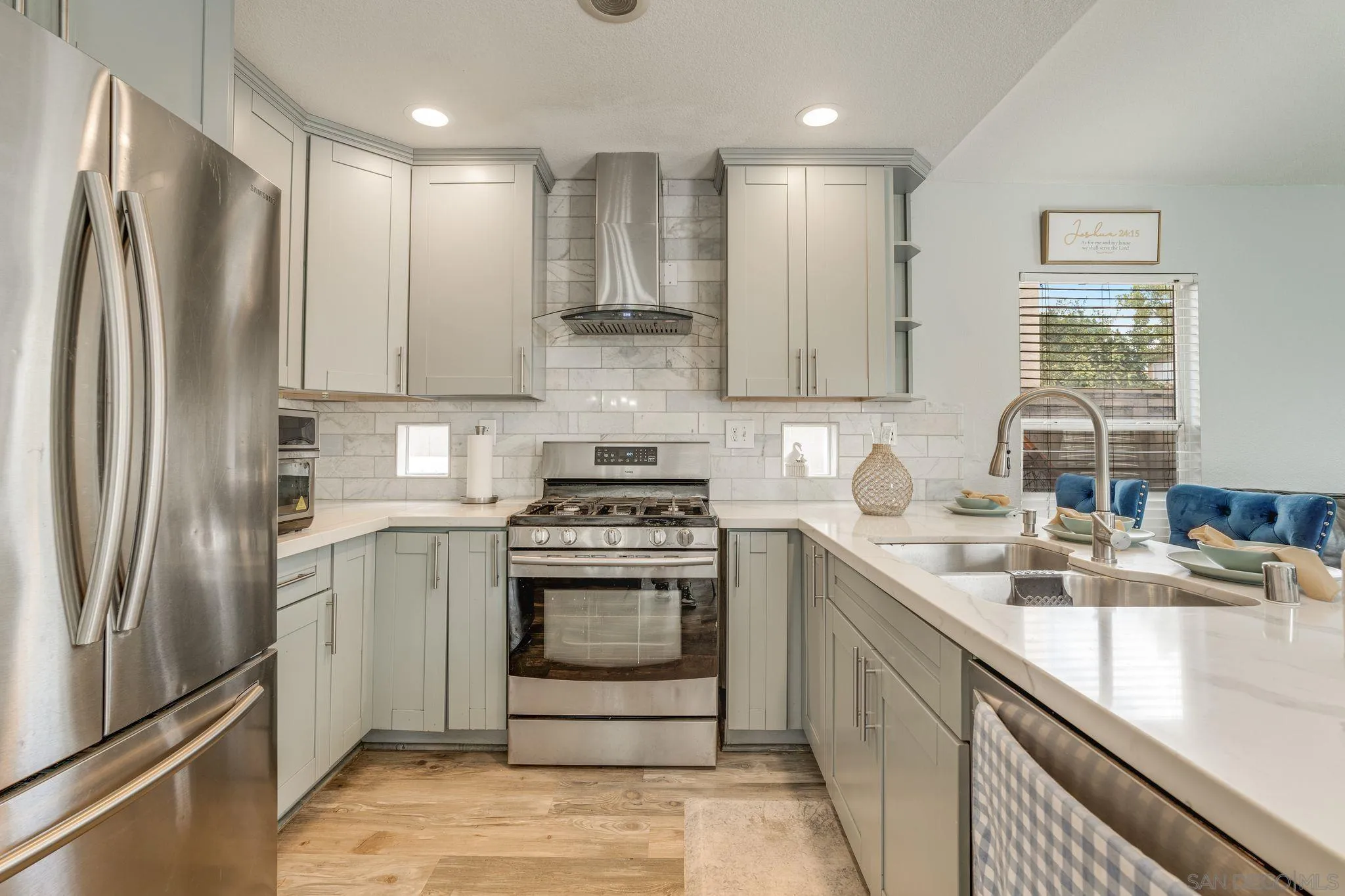 1616 Gold Run Road Chula Vista, CA 91913 - Photo 8 of 35 a kitchen with stainless steel appliances granite countertop a refrigerator sink and stove