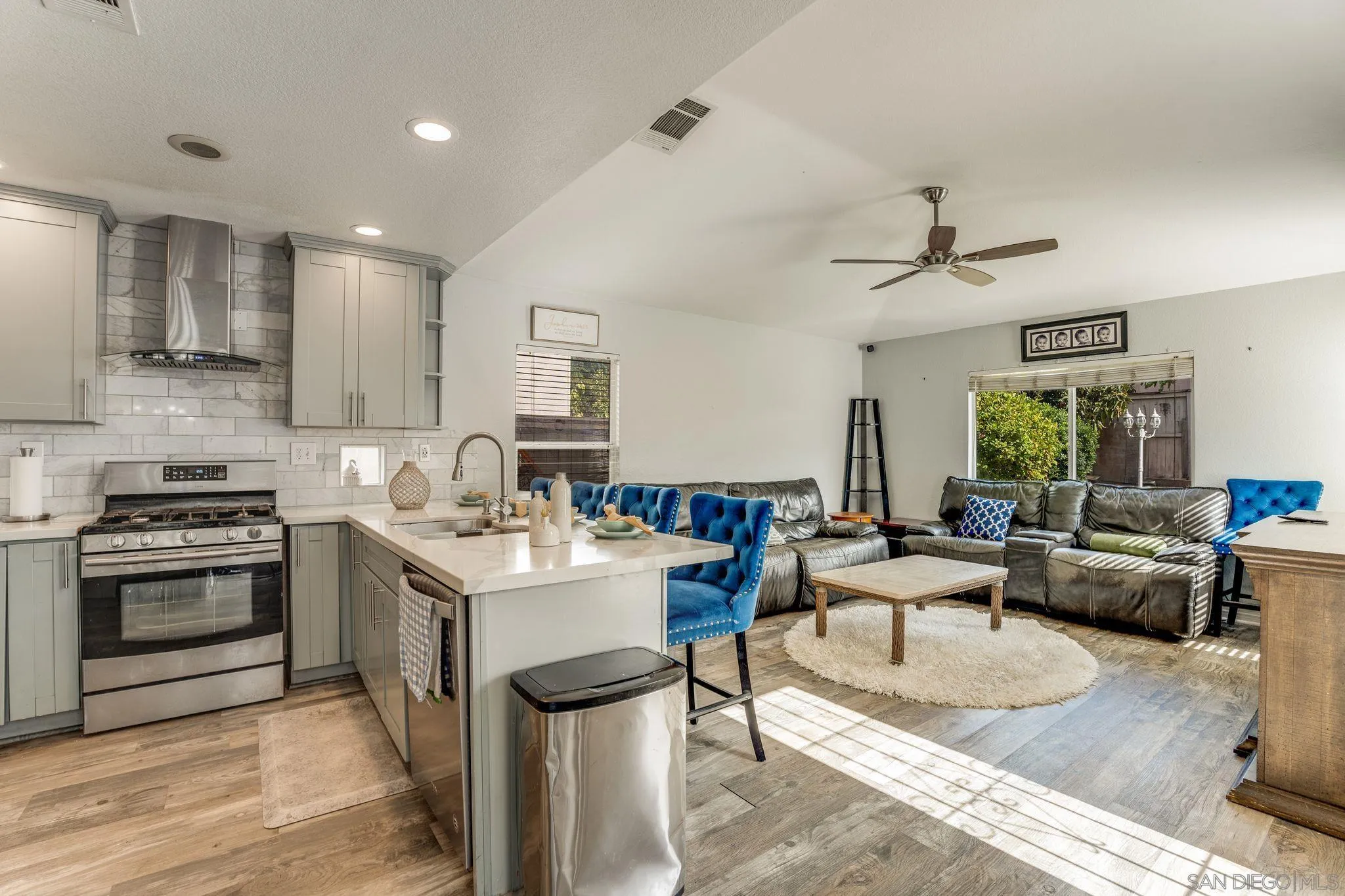 1616 Gold Run Road Chula Vista, CA 91913 - Photo 10 of 35 a living room with stainless steel appliances kitchen island furniture and a view of kitchen