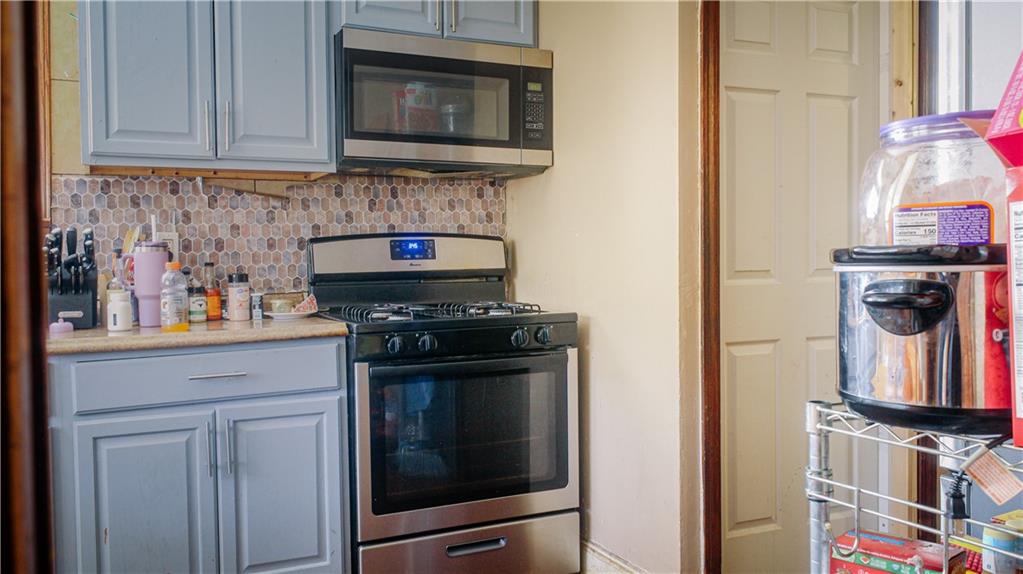 1638 Shady Drive Farrell, PA 16121 - Photo 7 of 21 a kitchen with a stove and a microwave