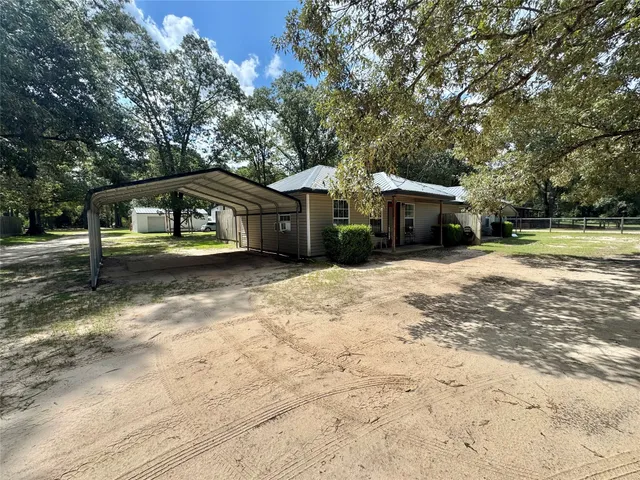 a view of a park with large trees
