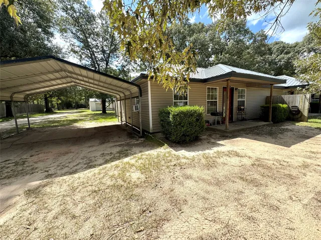 a view of a swimming pool with an outdoor space and seating area
