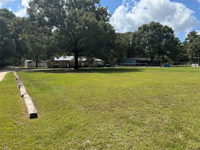 a view of a large swimming pool and an outdoor space