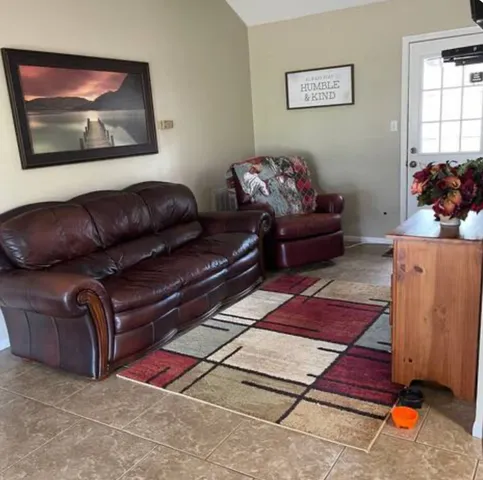 a living room with furniture and a gate