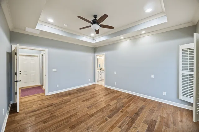 a bathroom with bathtub and window