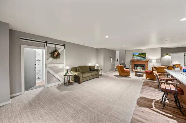 a view of empty room with wooden floor and windows