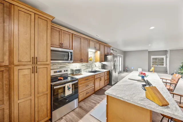 a view of a bathroom with a tub and shower