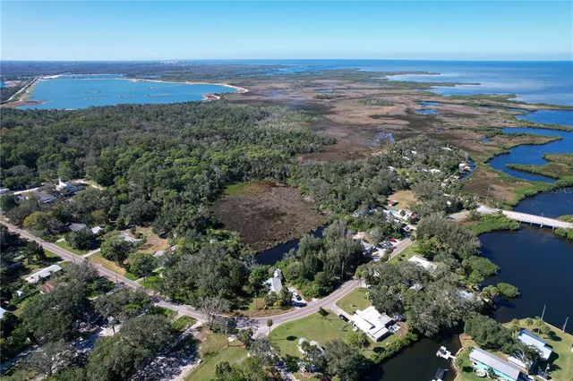an aerial view of residential house and green space