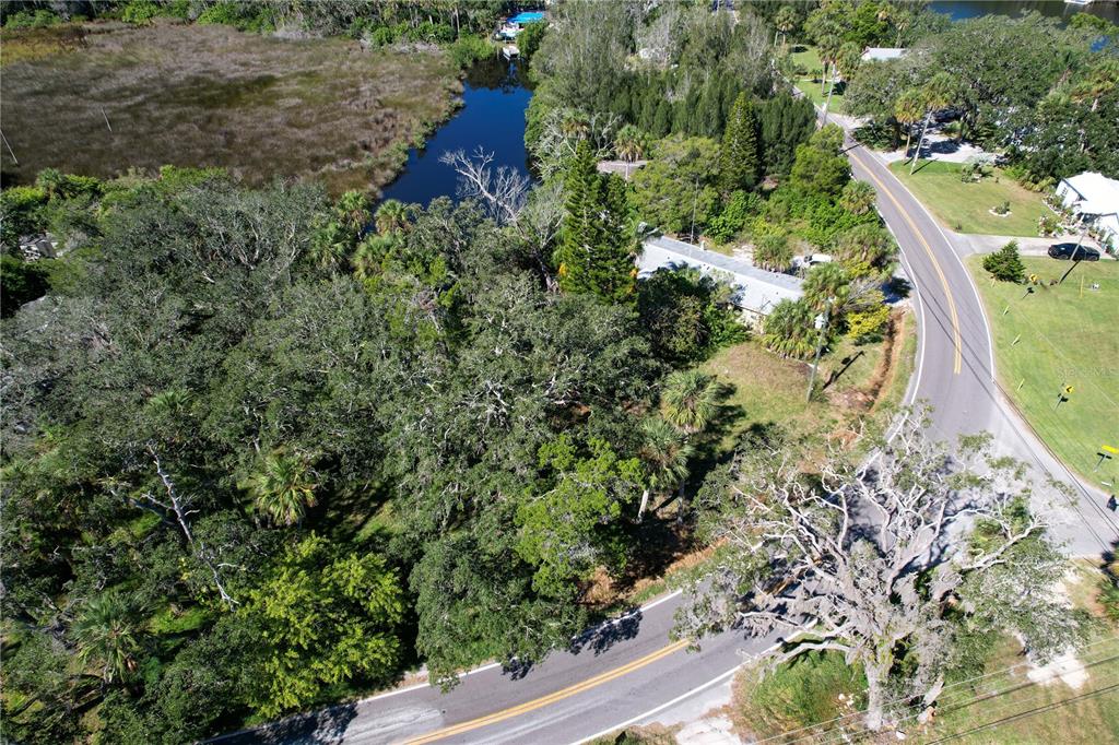 18905 Aripeka Road Aripeka, FL 34679 - Photo 34 of 43 an aerial view of residential house with outdoor space and trees all around